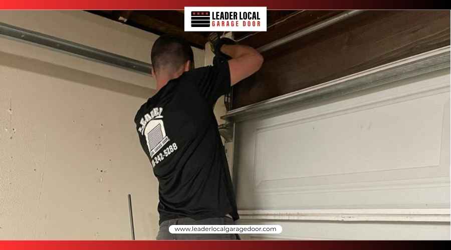 Professional technician inspecting a garage door